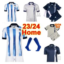 2023 2024 Real Sociedad Soccer Jerseys Cho Take Oyarzabal Sadiq Andre Zubimendi Brais Silva Mendez Merino le Normand Portu à la maison Men and Kids 23 24 Football Shirt