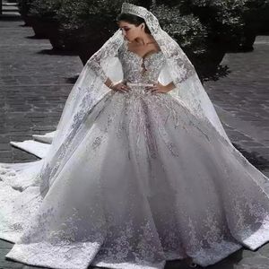 2023 Arabe Charme Une Ligne Robes De Mariée Illusion Pleine Dentelle Appliques Designer Cristal Perles Satin Manches Longues Chapelle Train 260I