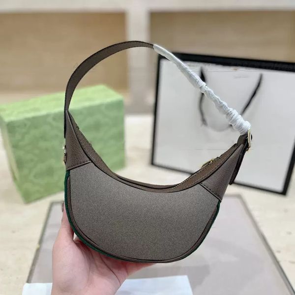 2023 Boutique Femme Une épaule sous les aisselles Sac à main courbé Lune de designer Mini Mode Shopping Portefeuille Cuir Imprimer Fermeture à glissière