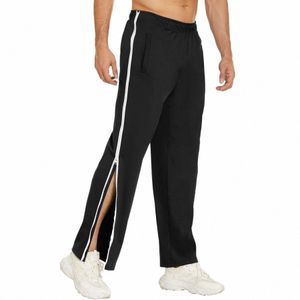 2023 Vêtements Hommes Zip Butt Splicing Casual Pantalon de déchirure Pantalon de basket-ball Pantalon de survêtement avec entraînement Masculinas Roupas Poches h2Im #