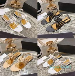 2023 Designer Bow chanclas planas zapatillas deslizantes para mujer 100% cuero albaricoque / negro / blanco Sandalias Casua para exteriores Lady sexy Tamaños de zapatos de tacón antideslizantes