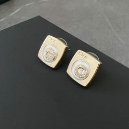 2023 Pendientes de perno prisionero del diseñador del bloque de la manera para las mujeres claras elegantes letras agradables del encanto de lujo del diamante OL pendiente aretes anillos de oreja joyería