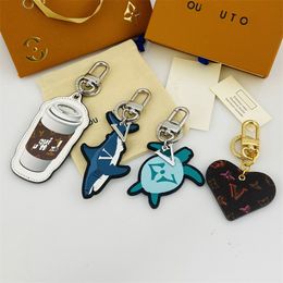 2023 sleutelhangers Klassiek patroon lederen sleutelhanger Vrouwelijke cartoon sleutelhanger Designer Unisex accessoires Mode tassleutelkoorden Hoge kwaliteit sleutelkoorden voor sleutels