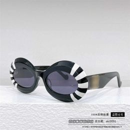 2023 Luxusdesigner 23 Neue Luo Yijia Sonnenbrille runder Rahmen Mesh rot INS im gleichen Stil personalisierte und modische Sonnenbrille LW40091
