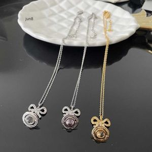 2023 Nouveau Designer Bague Pendentif Colliers Western Empress Dowager Fashion Girl Sweet Cool Bow 3D Saturn Collier Plein de Diamants Or et Argent Poudre Couches Bchg