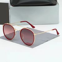 2023 nouvelle mode lunettes de soleil à monture ronde hommes et femmes tendance lunettes de soleil réfléchissantes en plein air street shot lunettes de soleil