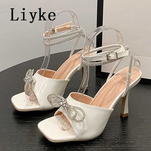 2023 NIEUWE Glitter Rhinestones Bowknot Summer Women Sandalen vierkant teen Crystal buckle riem dunne hoge hakken feest prom schoenen 0129