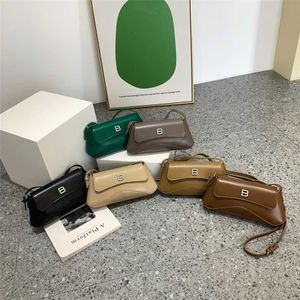 2023 portemonnees opruiming outlet online verkoop mode mode schouder Koreaanse versie dames solide kleur eenvoudige wet stick stick stick cross-body tas