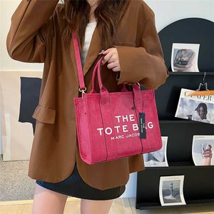 2023 portemonnees opruiming outlet online verkoop gestileerde middelgrote letter afdrukken scrub Koreaanse dames schouder mode schuine straddle draagtas