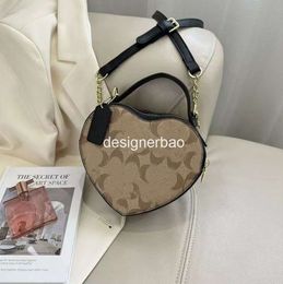 Bolso con forma de corazón de diseñador de calidad 2023, Mini bolso de hombro bonito para mujer, bolso Vintage nublado, bolso cruzado de cuero a la moda rosa