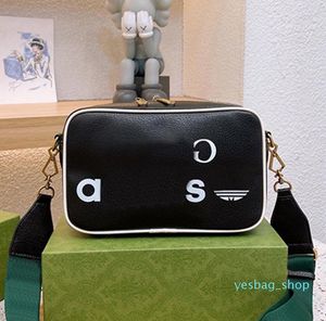 2023 Ronde Crossbody tas vrouwen co-branded camerastassen mode letters rood groen lint echt lederen goud metalen onderdelen hoogwaardige handtassen portemonnee