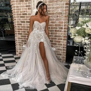 2023 Sexy Strand Boho A-lijn Trouwjurken Huwelijk Bruidsjurken voor Bruid Elegant Kant Kralen Strapless Illusie Doorschijnend Mouwloos Hoge Zijsplit Prinses Plus