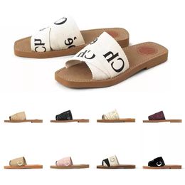 2023 Slippers Designer Vrouwen Woody Platte Muilezels Sandalen Slides Zeil Canvas Wit Zwart Vrouwen Outdoor Strand Slipper schoenen MOET hebben voor de zomer