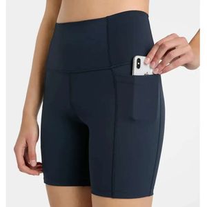 2023 Printemps et été Nouveau pantalon de sport à poches latérales multi-panneaux pour femmes taille haute hanche levage élastique serré Fiess Yoga Shorts 688ss