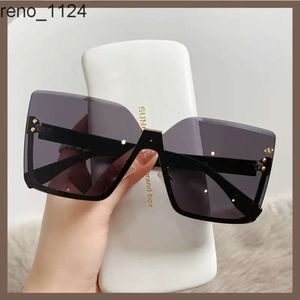 2023 Gafas de sol para mujer, diseño de ojo de gato, nuevas gafas de sol al por mayor sin montura de bajo precio para mujer