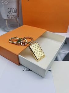 2023 La nouvelle boîte d'origine de ceinture de porte-clés d'enveloppe d'or de luxe de mode