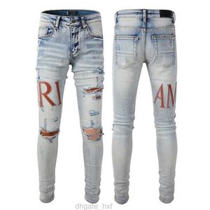 2023SS Designer Jeans pour hommes hip-hop mode fermeture éclair trou lavage jean pantalon rétro déchiré pli couture hommes conception moto équitation cool slim pantalon violet jeans pour femmes.