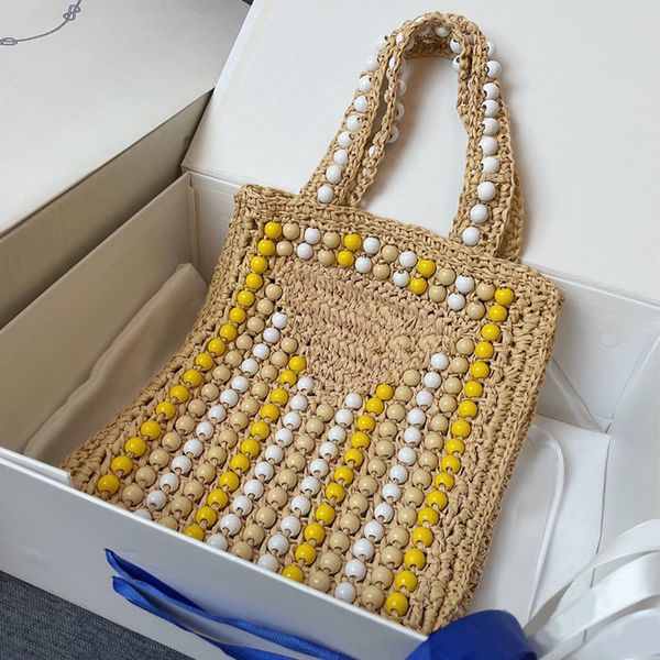 2023ss Nuevas cuentas Bolsa de asas de paja Tejido Bolsa de compras de moda Bolso de mujer 3 colores Totes de playa de ganchillo de calidad superior Gran capacidad Ahueca hacia fuera