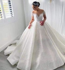 2024 Arabe Dubai Sequins Robe de mariée Scoop Beads Perles Illusion Couches courtes Boube de bal Bride Bride Bride