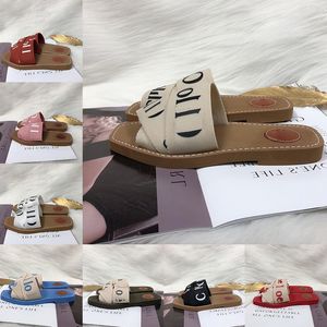 Sandalias leñosas para mujeres Damas letras de letras lienzo mulas de tacones bajos moda damas de lujo zapatos casuales zapatillas zapatillas chioe tobogán de madera sandale