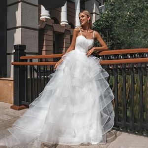 2024 Elegante trouwjurk Spaghetti Banden mouwloze ruches Tiered Tule Bridal Bride Jurns Vestido de novias Mariage