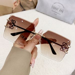 2024 Des lunettes de soleil créatrices de mode hommes classiques en métal sans cadre sans cadre de luxe de luxe féminine verres de soleil uv protection lunettes