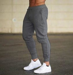 2024 Fashion Men Gyms Pure Color Pants Joggers Fitness informal de pantalones largos Hombres entrenando pantalones de chándal de chupas de chándal del flaco 240506