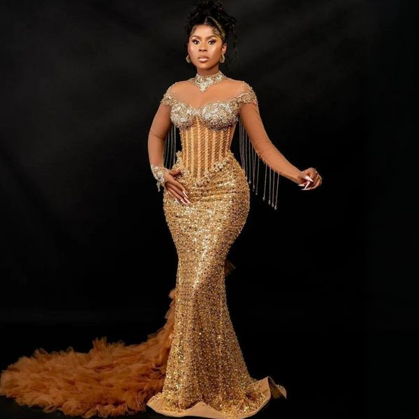 2024 Vestidos de fiesta dorados de talla grande Aso Ebi para mujeres negras Vestido de fiesta de ilusión Sirena Mangas largas Cuello alto Perlas Borla Vestido de cumpleaños de encaje con cuentas para ocasión NL640