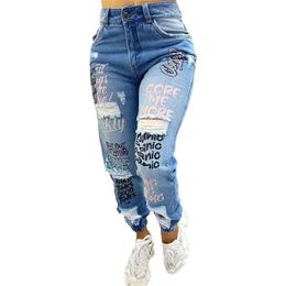 2024 Graffiti Letter Afdrukpotlood Jean Trend Streetwear Slim High Taille denim broek vrouwelijke mode gebroken gaten broek 240403