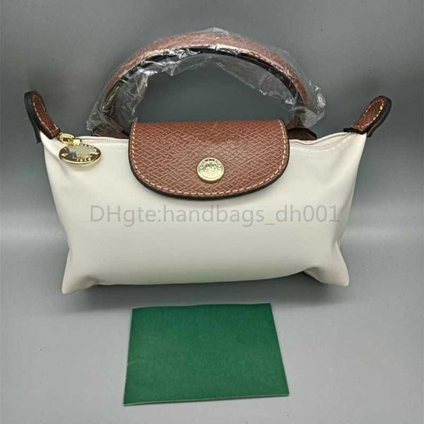 2024 Liquidación de bolsos al por mayor y bolso Monedero de corazón Bolso de cuero de lujo Tote Crossbody Primavera Verano Borse Cowhide Femme Mini Mujeres Dumplings