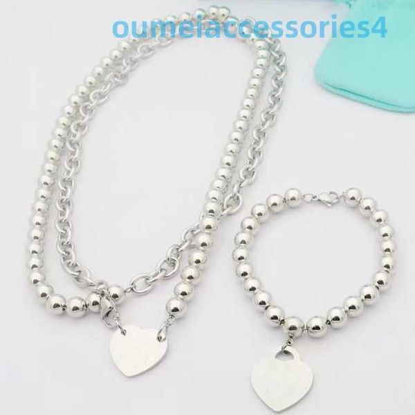 2024 Bijoux Designer Marque Pendentif Colliers Vente Chaude En Acier Inoxydable Coeur De Pêche Perle Ronde Femmes Titane Acier Bracelet