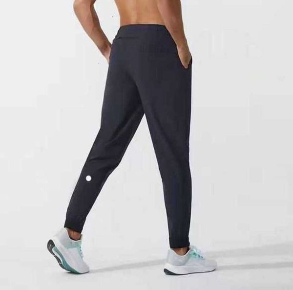 2024 Lulu Sport Lemons Leggings rápidos Alinear traje Hombres Pantalones Yoga Cordón seco Gimnasio Bolsillos Pantalones deportivos Pantalones para hombre Casual Cintura elástica