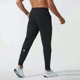 2024 lululemenI Pantalon long de jogging pour hommes Tenue de yoga à séchage rapide avec cordon de serrage Poches de sport Pantalon de survêtement Pantalon décontracté Taille élastique Fiess kgo666