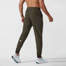 2024 lululemeni Mujeres pantalones cortos traje de yoga jogger deporte de secado rápido cordón gimnasio bolsillos pantalones de chándal pantalones para hombre casual cintura elástica fiess kgi668
