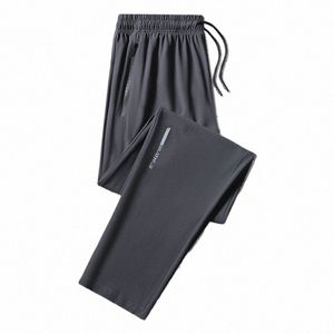 2024 Pantalon décontracté droit en vrac pour hommes Pantalon à séchage rapide en soie glacée pour hommes Pantalon de travail à poche zippée Grande taille Jogging 8XL L69j #