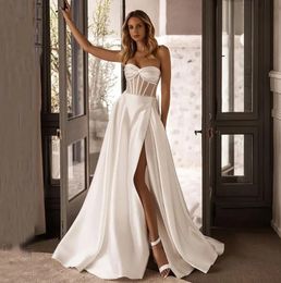 2024 Vestido de novia moderno Cuentas de novia Corsé dividido lateral Satén Dubai Mujeres Una línea Vestidos de novia Vestidos de novia por encargo Robe De Mariage