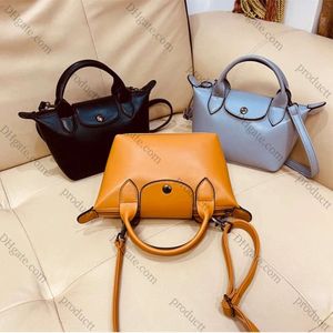 2024 NOUVEAU MIGNE EXQUISURE Cuir Dumpling Bag Designer Solid Minies Crossbody Sac Shopping Travel Sac à bandoulière