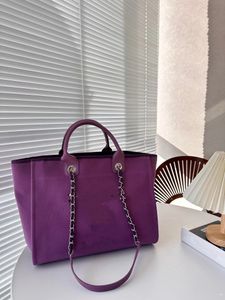 2024 Nieuwe modeontwerp klassieke parelstrandtas voor dames, gemaakt van canvasmateriaal, eenvoudig en casual, grote capaciteit, praktische en veelzijdige handtas