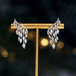 2024 Nouvelle tendance de la mode Design unique élégant exquis Zircon ailes d'ange 14K boucles d'oreilles en or blanc femmes bijoux fête haut cadeau en gros