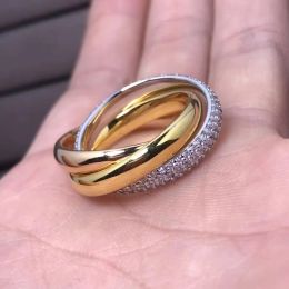 2024 NUEVA JEYRYTRINITY Ring Series Brand de lujo Reproducciones oficiales de estilo clásico Rings de alta calidad Marcas Diseño Exquisito regalo de cumpleaños de regalo Etincelle L