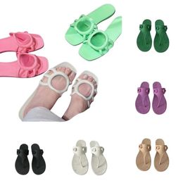 2024 Nieuwe slippers klassieke slippers in elkaar grijpende g uitgehakte glijbanen string sandalen beroemde designer dames slipper jelly rubber metaal buckle zomer strand muilezels mocassin