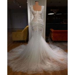 2024 Robes de mariée de sirène arabe sexy illusion scoop cou caux de cristal perles manches longues robes de mariée plus taille de balayage de taille 0513