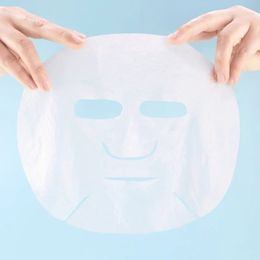 2024 Masque facial de compression de compression en coton en soie Masque facial sèche non tissé Papier Salon de beauté Masque facial hydratant des femmes Sure, ici