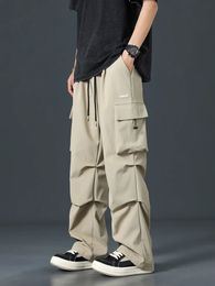 2024 Pantalons de fret d'été Men Streetwear Multi-poches Pantalons décontractés à jambe large pantalon raide mâle plus taille 8xl 240420