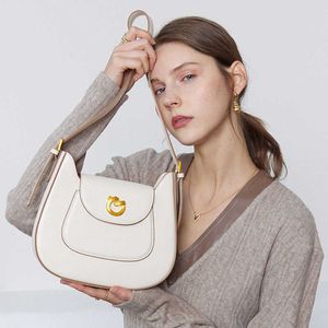 2024 Zomer veelzijdige zadelzak koehide dames ontwerp sense uniek echt leer één schouder crossbody