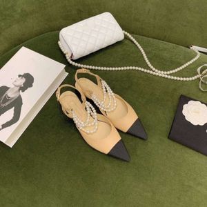 Xiaoxiangfeng – chaussures plates avec chaîne de perles pointues Baotou, bloc de couleur noir et blanc, chaussures à bouche légère, sandales creuses pour femmes, été 2024