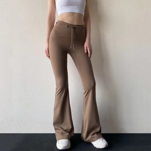 2024 Le dernier micro pantalon de yoga taille haute pour femme tire à l'extérieur pour porter un pantalon évasé maigre et grand, sens nu de la hanche, sport, fitness