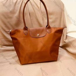 2024 Weekender Nylon Shop Long Tote Sac Dumpling Sac pliant pochette Luxurys sac à main Sac de créateur de femmes 3