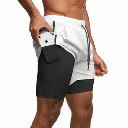 2024 nuevos modelos de verano pantalones cortos deportivos hombres de dos pisos jogging pantalones cortos para correr hombres 2 en 1 pantalones cortos de gimnasio para hombre Fitn entrenamiento corto Pan N313 #