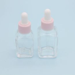 20 ml vierkante druppelflesje etherische olie 30 ml helder glazen serumflessen met roze dop voor cosmetische Roqle